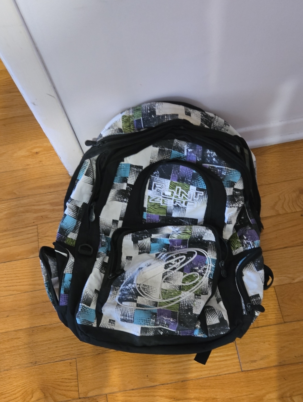 Point Zero White Backpack with Blue, Green, and Purple Accents